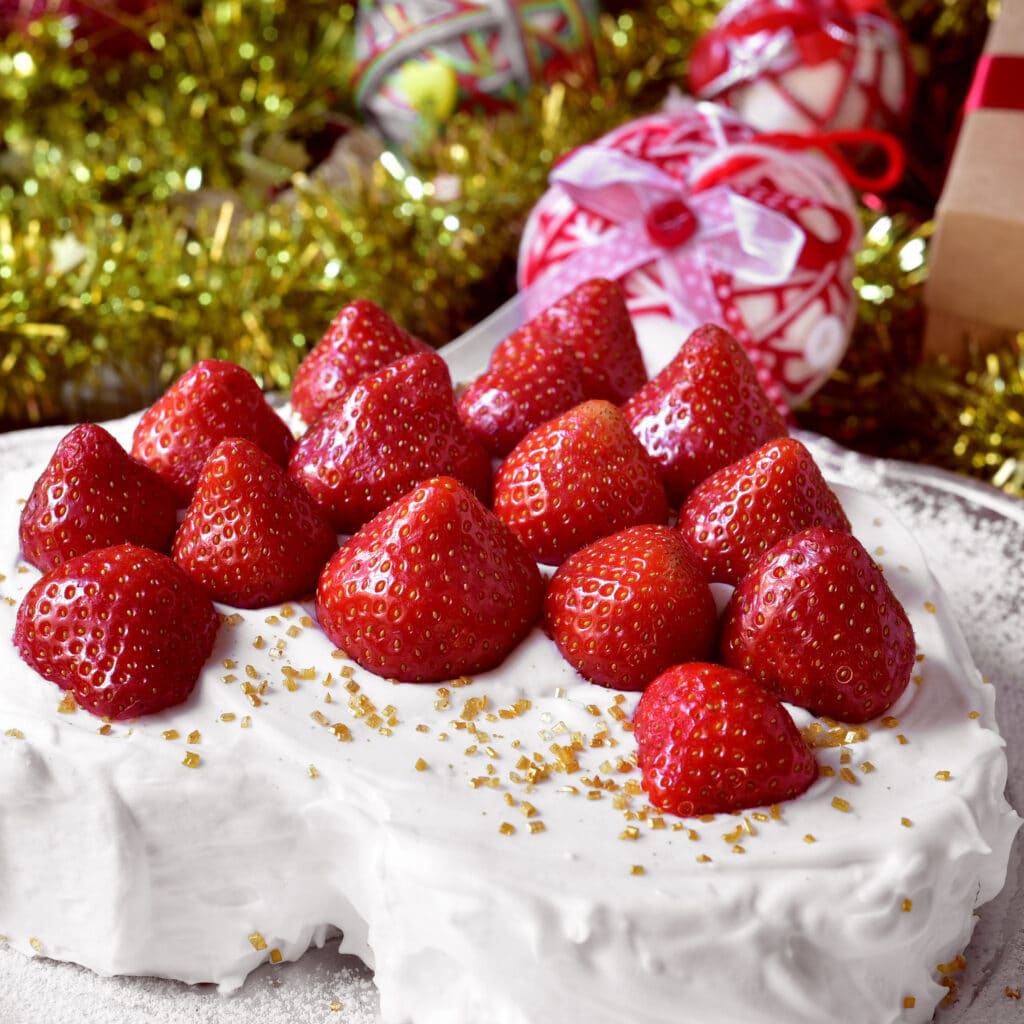 Japanese Christmas cake - a heart-shaped cake covered with cream and topped with strawberries